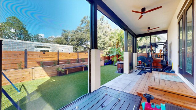 dock area with a wooden deck and a lawn