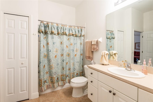 bathroom featuring vanity, toilet, tile patterned floors, and curtained shower