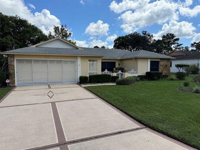 ranch-style home with stone siding, a front yard, stucco siding, an attached garage, and driveway