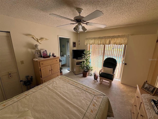 unfurnished bedroom featuring a textured ceiling, light colored carpet, a closet, and ceiling fan