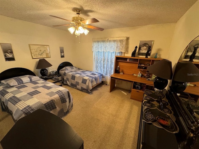 carpeted bedroom featuring a textured ceiling and ceiling fan