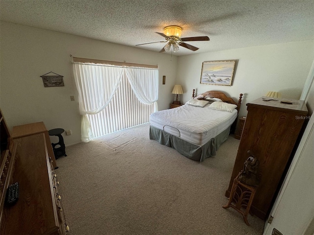 bedroom with a textured ceiling, light colored carpet, and ceiling fan