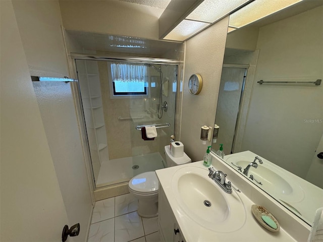 bathroom with vanity, toilet, and walk in shower