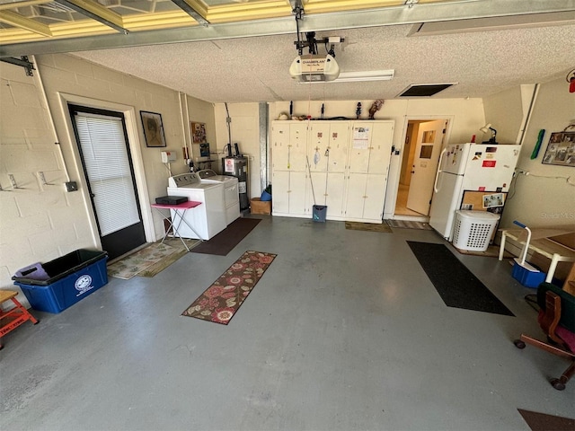 garage featuring white refrigerator, separate washer and dryer, a garage door opener, and water heater