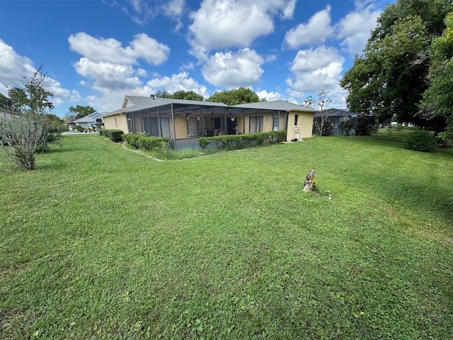 view of yard with a lanai