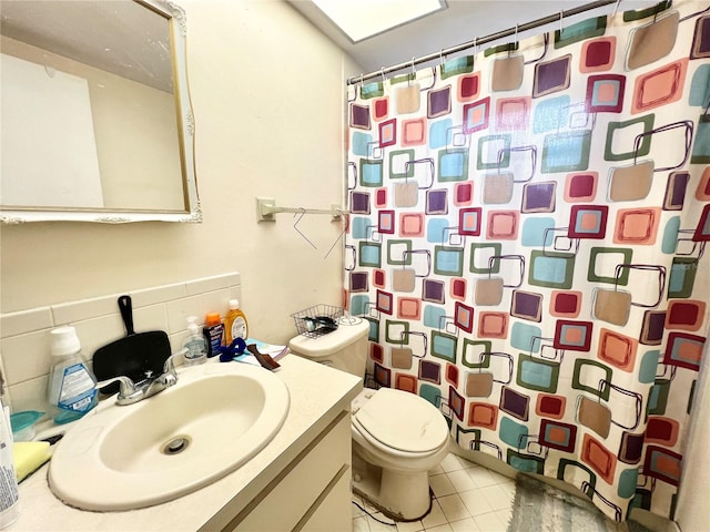 bathroom featuring backsplash, vanity, a shower with shower curtain, tile patterned flooring, and toilet