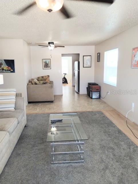 unfurnished living room with a textured ceiling