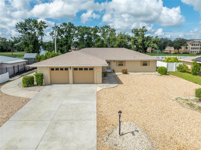 ranch-style house featuring a garage