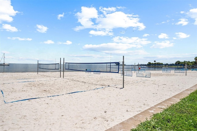 view of community featuring a water view and volleyball court