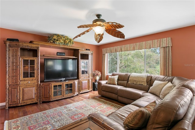 living room featuring hardwood / wood-style floors and ceiling fan