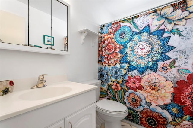 bathroom featuring vanity, toilet, tile patterned flooring, and a shower with shower curtain