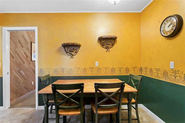 dining room featuring crown molding