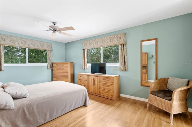 bedroom featuring light hardwood / wood-style floors and ceiling fan