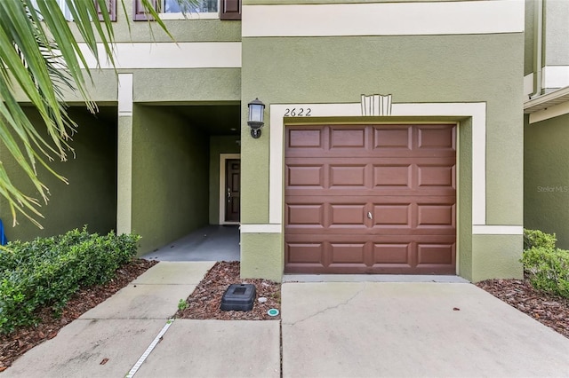 view of exterior entry featuring a garage