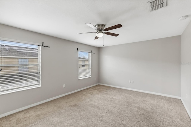 empty room with light carpet and ceiling fan