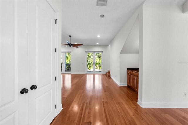 interior space featuring ceiling fan and light wood-type flooring