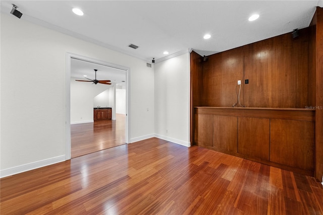 spare room with ceiling fan and hardwood / wood-style floors