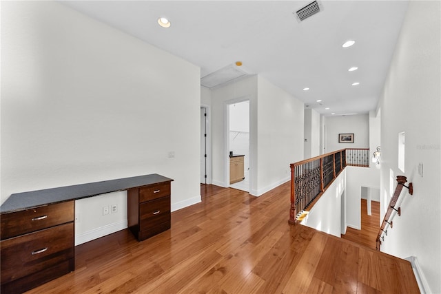 hall with wood-type flooring