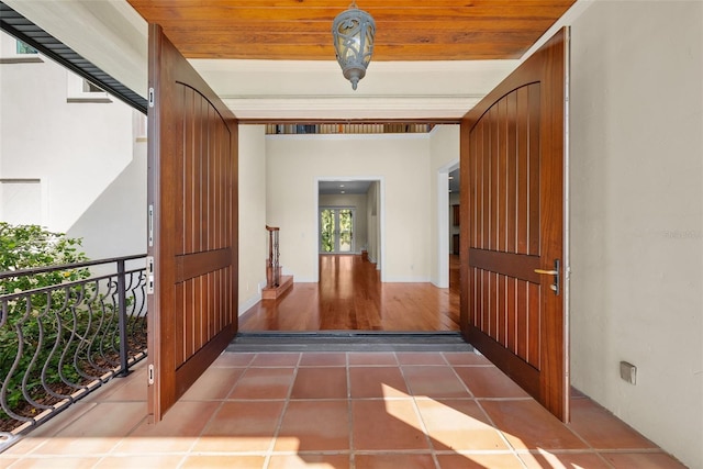 entryway featuring wood ceiling and dark hardwood / wood-style floors