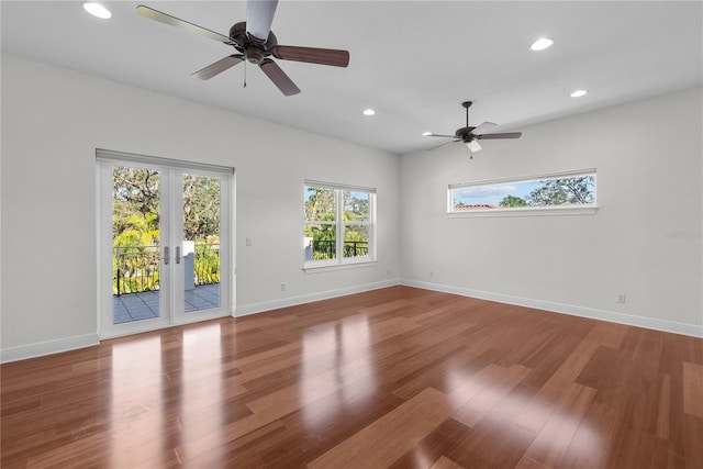 unfurnished room featuring french doors, ceiling fan, and wood-type flooring