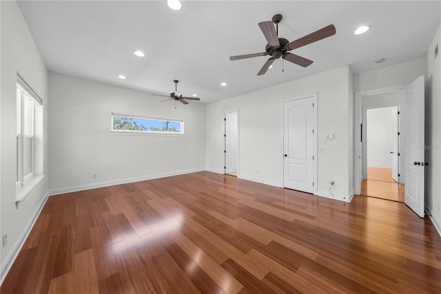 interior space with wood-type flooring and ceiling fan