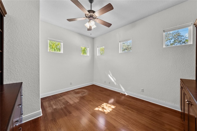 interior space featuring dark hardwood / wood-style flooring and ceiling fan