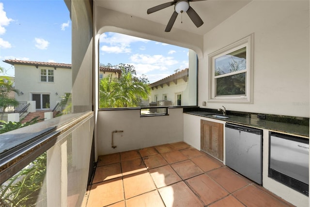 exterior space featuring an outdoor kitchen, ceiling fan, and sink