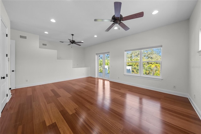 spare room featuring hardwood / wood-style flooring and ceiling fan