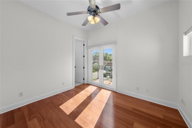 empty room featuring ceiling fan, french doors, and wood-type flooring