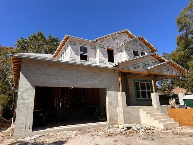 unfinished property with a garage