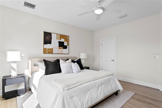 bedroom with hardwood / wood-style floors and ceiling fan