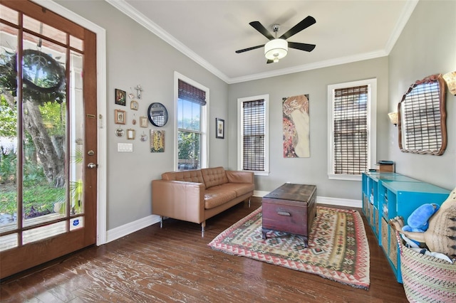 sitting room featuring ornamental molding, dark wood-type flooring, and ceiling fan