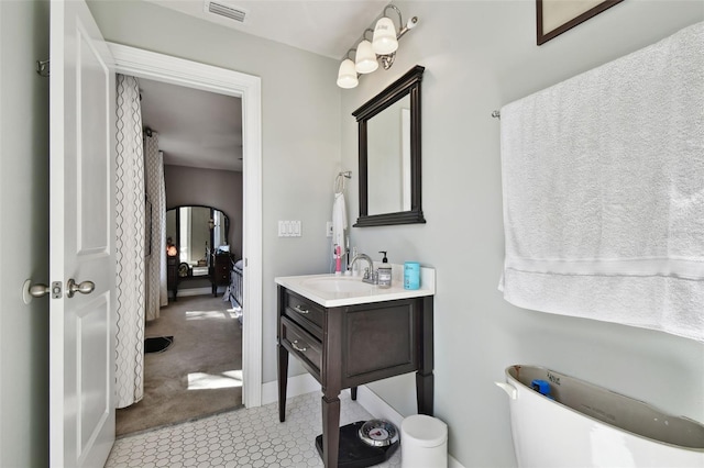 bathroom featuring vanity and tile patterned flooring