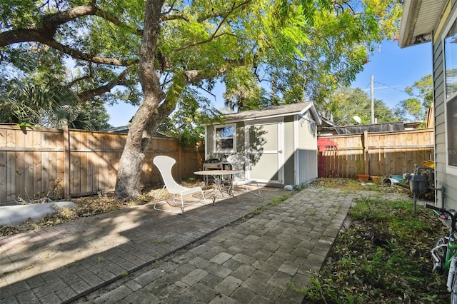 view of patio / terrace featuring a storage shed