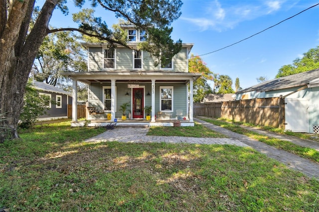 view of front of property with a front yard and a porch