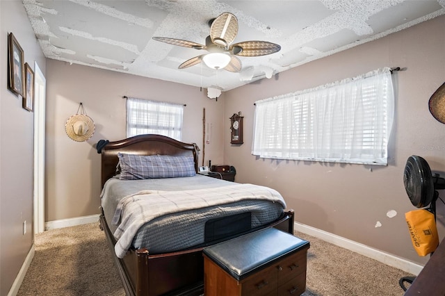 bedroom with ceiling fan and carpet flooring