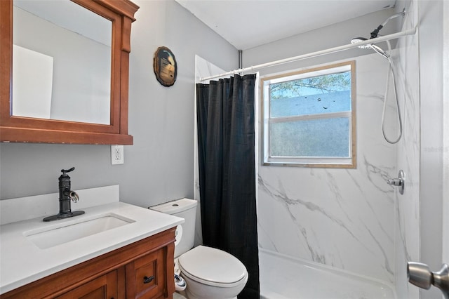 bathroom with vanity, a shower with shower curtain, and toilet