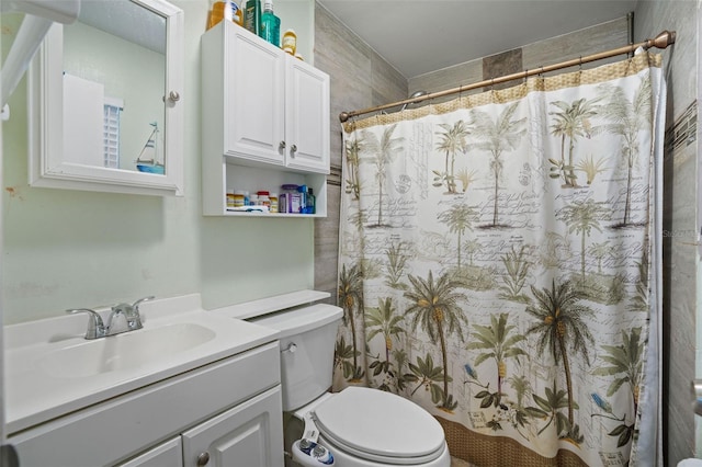 bathroom featuring toilet, a shower with curtain, and vanity