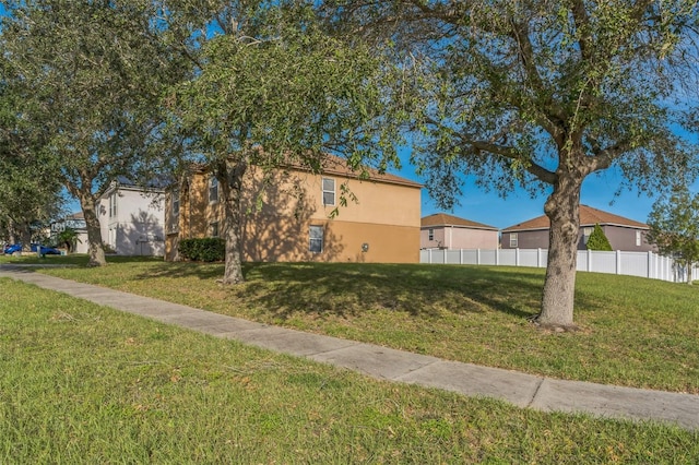 view of home's exterior with a yard