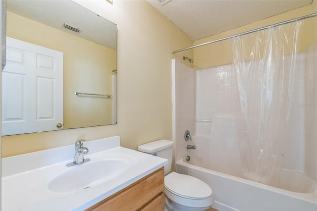 full bathroom with vanity, toilet, a textured ceiling, and shower / tub combo with curtain