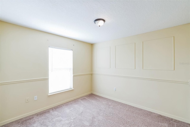 carpeted spare room with a healthy amount of sunlight