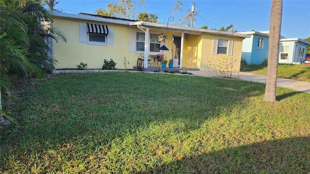 ranch-style house featuring a front yard