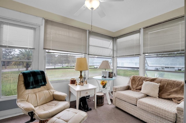 sunroom / solarium featuring plenty of natural light and ceiling fan