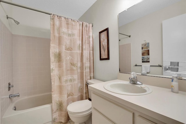 full bathroom featuring vanity, a textured ceiling, shower / tub combo with curtain, and toilet