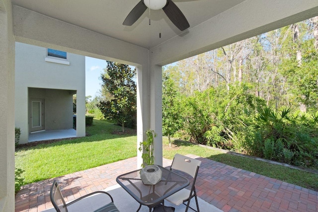 view of patio / terrace featuring ceiling fan