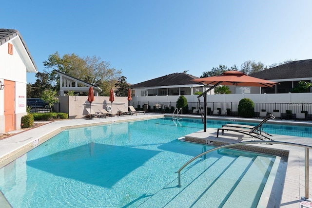 view of swimming pool featuring a patio area