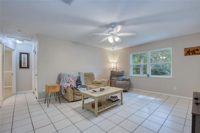 tiled living room with ceiling fan