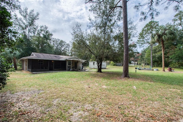 view of yard with a sunroom