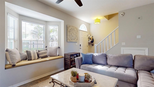 living room featuring hardwood / wood-style flooring and ceiling fan