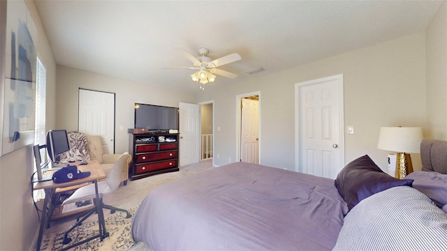 bedroom featuring ceiling fan and light colored carpet